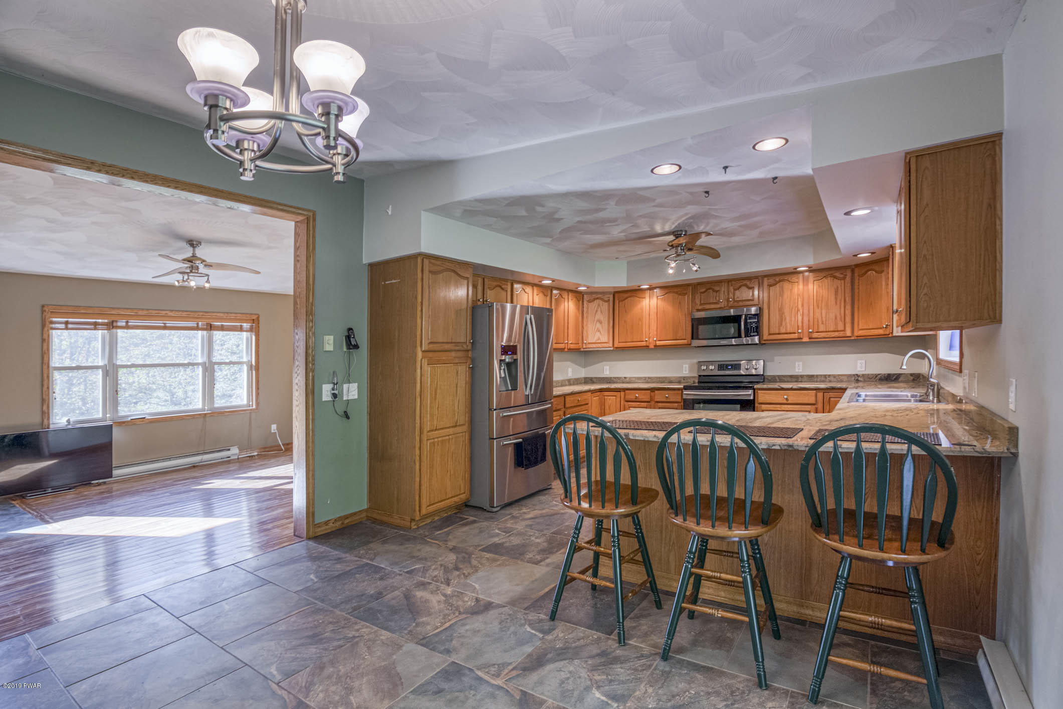 424 Old Gravity Road Lake Ariel, PA 18436 - Photo 5 of 46 a table room with a dining table chairs and a chandelier
