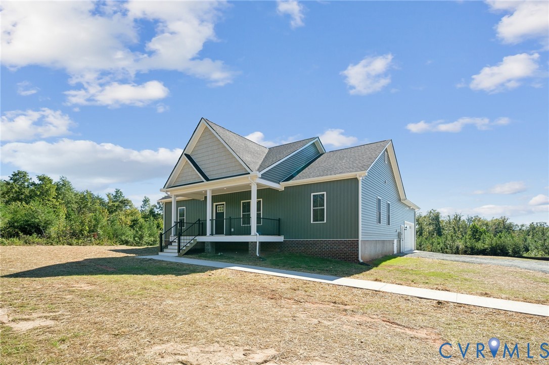 2305 Halls Store Road Mineral, VA 23117 - Photo 1 of 26 a view of house with backyard and bushes
