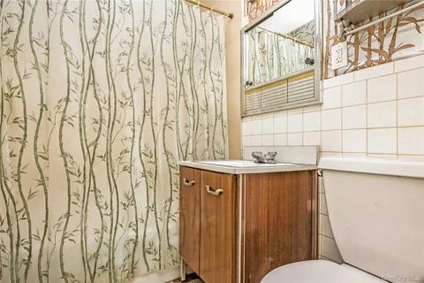 a bathroom with a sink and mirror
