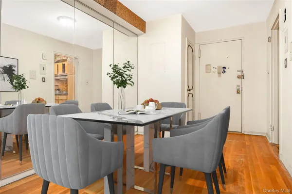 a view of a dining room with furniture and wooden floor