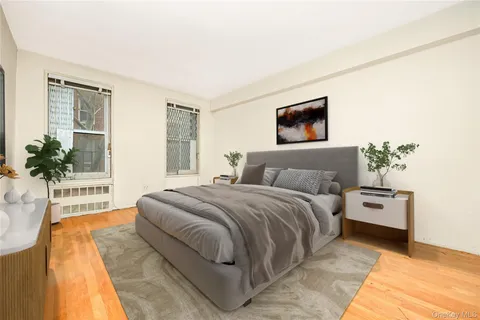 a spacious bedroom with a bed and a couch