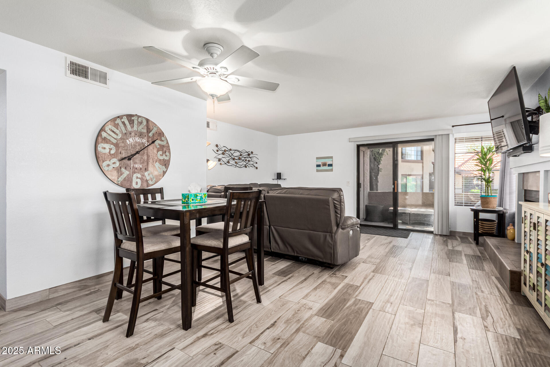 8700 East Mountain View Road, Unit 1014 Scottsdale, AZ 85258 - Photo 11 of 41 a dining room with a wooden table and chairs