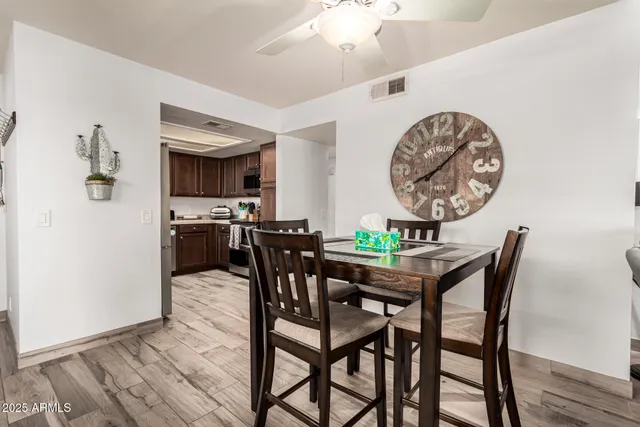 a view of a dining room with furniture and wooden floor