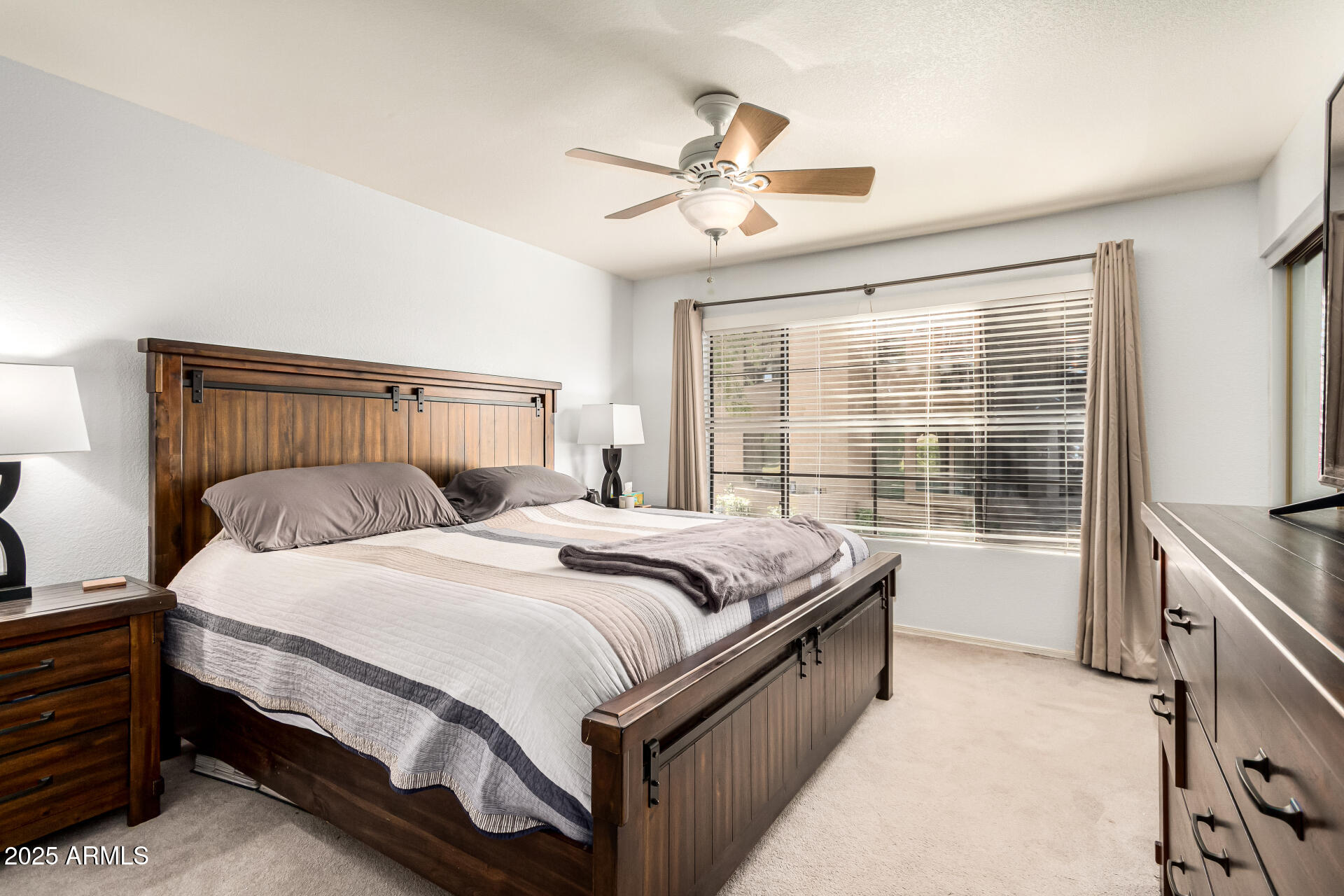 8700 East Mountain View Road, Unit 1014 Scottsdale, AZ 85258 - Photo 15 of 41 a bedroom with a bed and a large window
