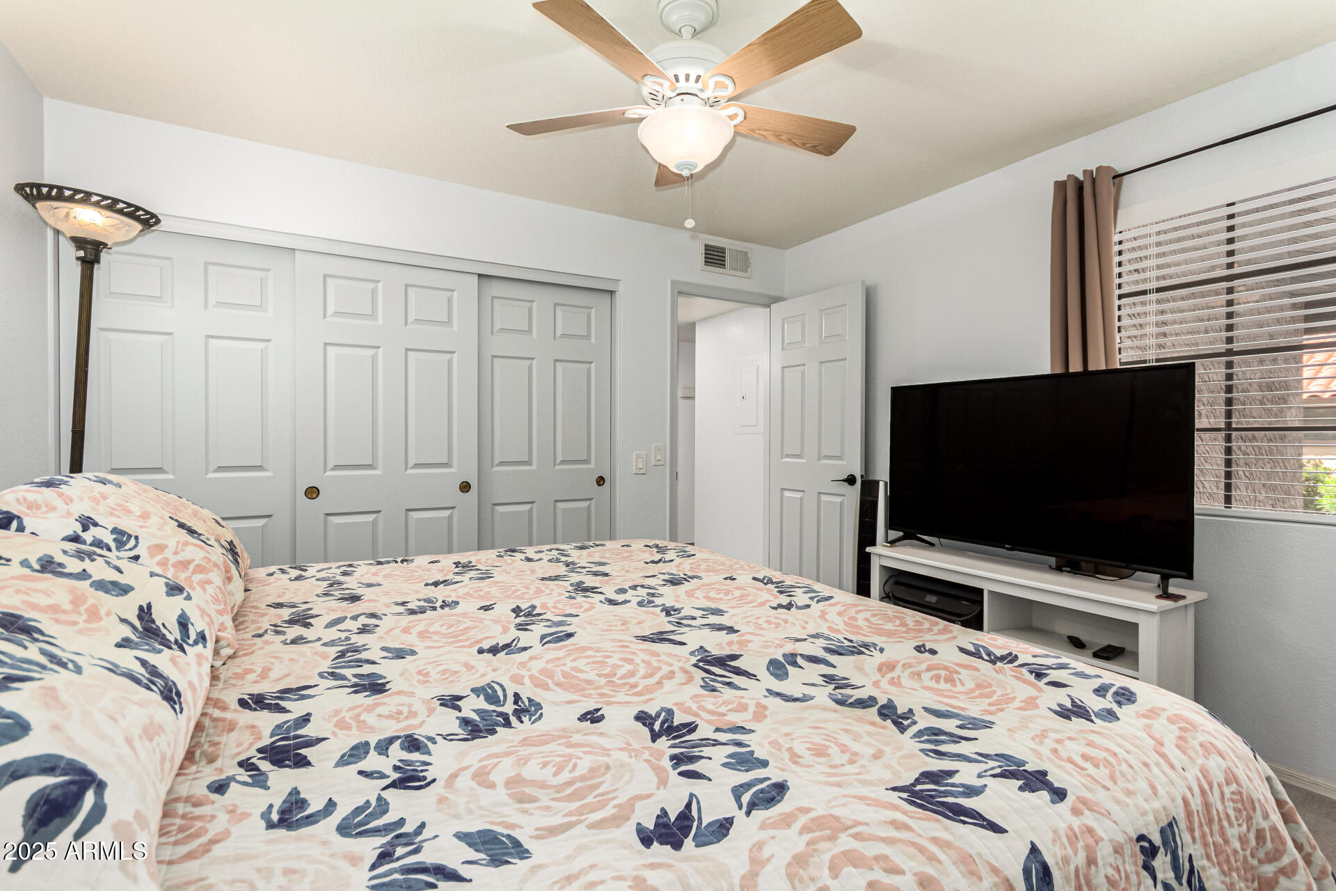 8700 East Mountain View Road, Unit 1014 Scottsdale, AZ 85258 - Photo 18 of 41 a bedroom with a bed and a flat screen tv