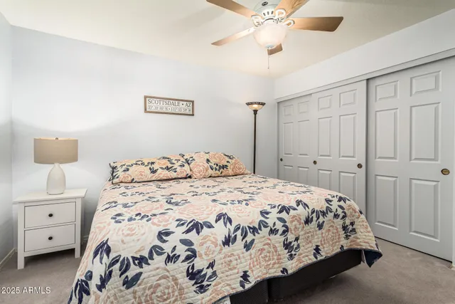 a bedroom with a large bed and a window