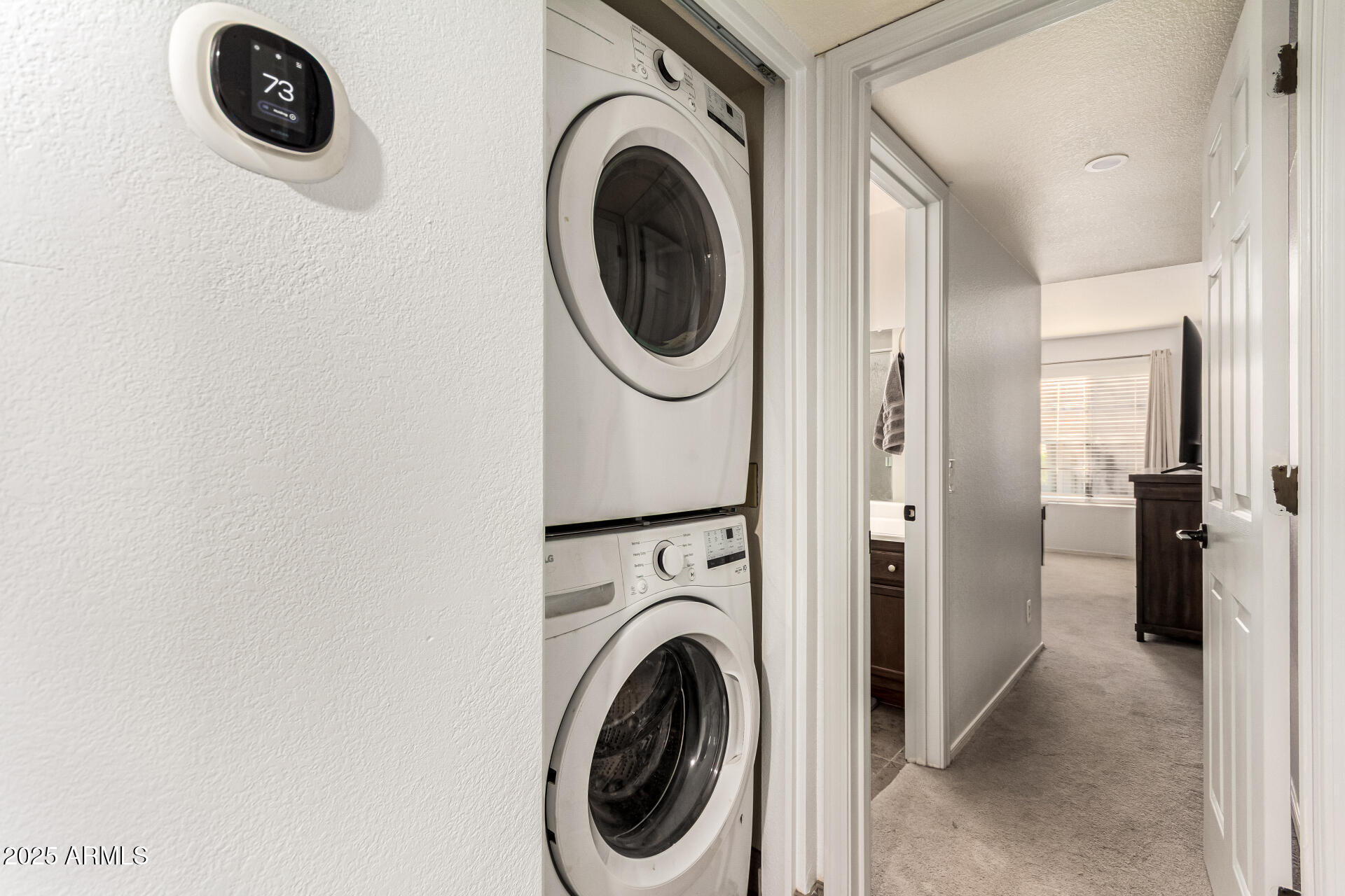 8700 East Mountain View Road, Unit 1014 Scottsdale, AZ 85258 - Photo 22 of 41 a view of a storage and utility room with washer and dryer