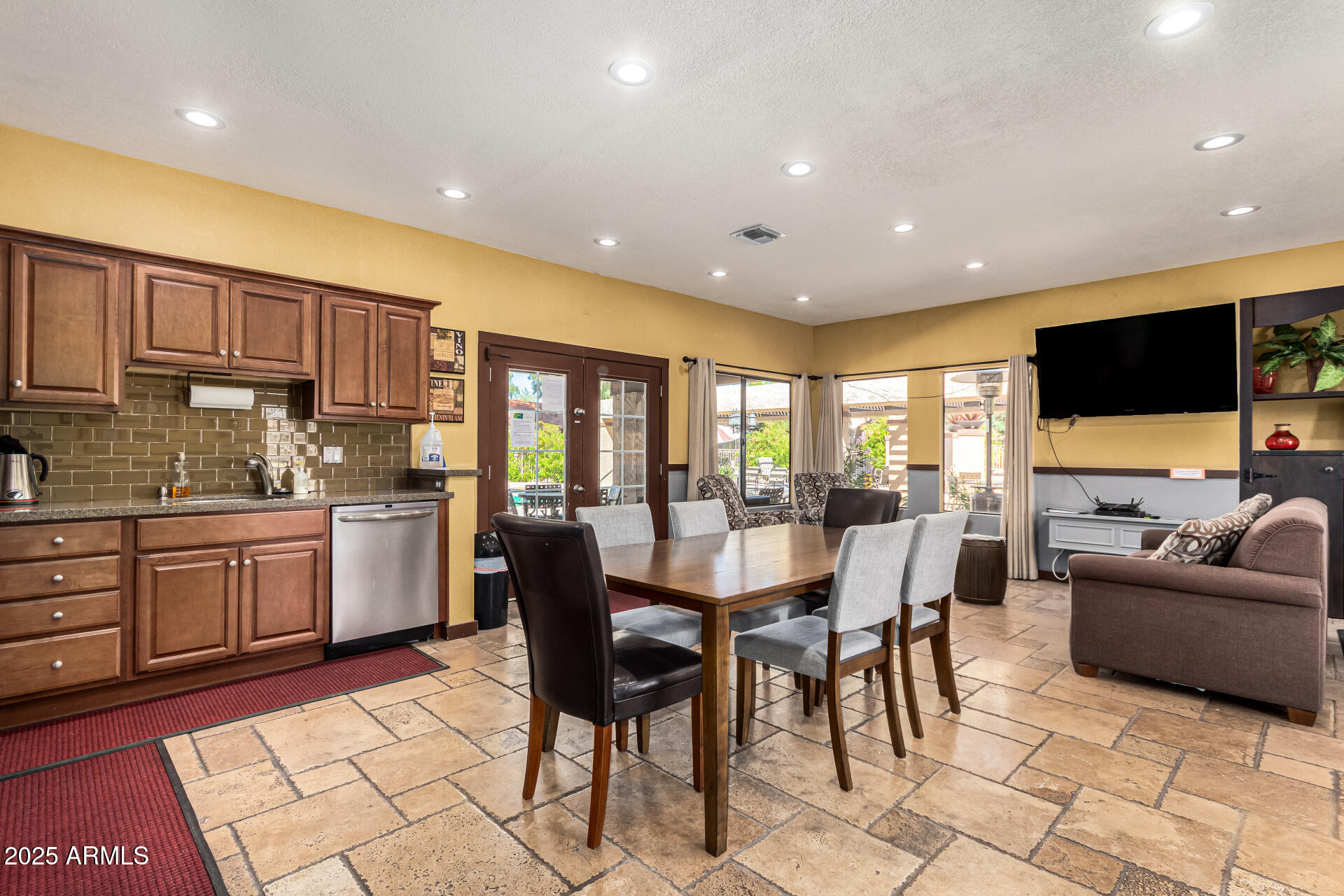 8700 East Mountain View Road, Unit 1014 Scottsdale, AZ 85258 - Photo 37 of 41 a view of a dining room with furniture and a kitchen
