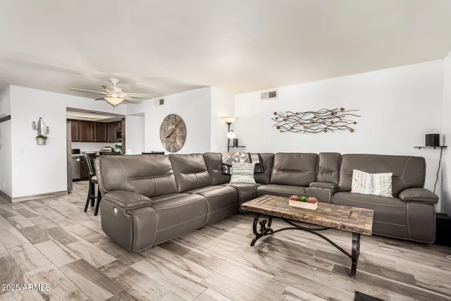 a living room with furniture and a rug