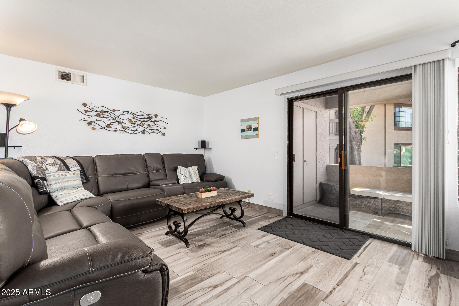 8700 East Mountain View Road, Unit 1014 Scottsdale, AZ 85258 - Photo 7 of 41 a living room with furniture and a floor to ceiling window