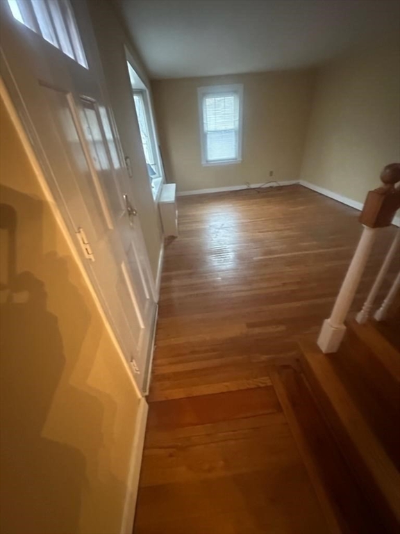31 Badger Road Boston, MA 02136 - Photo 11 of 19 a view of an empty room with wooden floor and a window