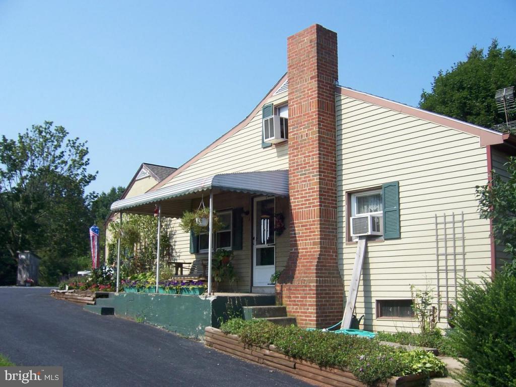 788 Hopeland Road Lititz, PA 17543 - Photo 2 of 7 a view of a house with a patio and a yard