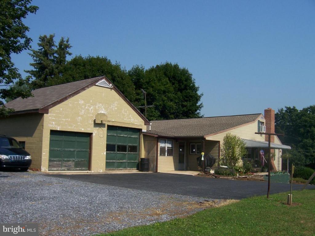 788 Hopeland Road Lititz, PA 17543 - Photo 3 of 7 a view of a house with a yard and garage