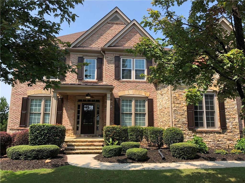 front view of a house with a yard
