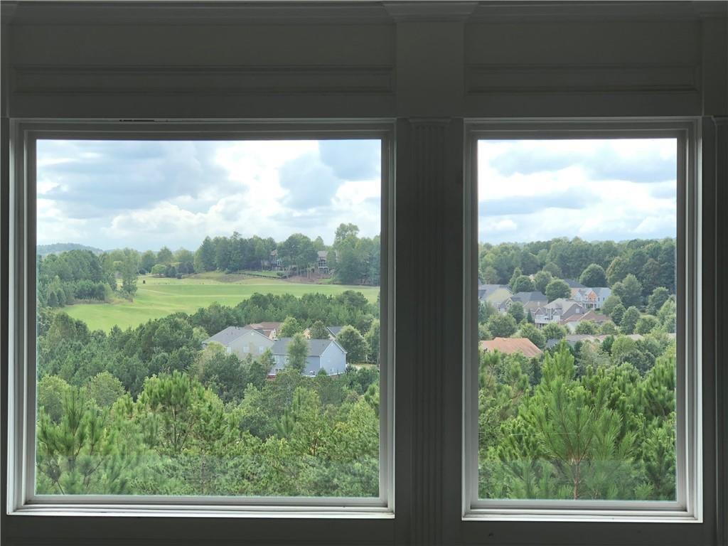 2575 Goodrick Lane Cumming, GA 30041 - Photo 20 of 30 a view of a green field with some trees in the background