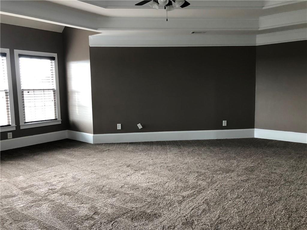 2575 Goodrick Lane Cumming, GA 30041 - Photo 24 of 30 a view of a livingroom with an empty space and window