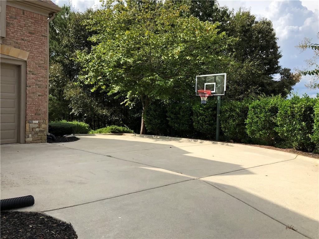 2575 Goodrick Lane Cumming, GA 30041 - Photo 5 of 30 a backyard of a house with lots of green space