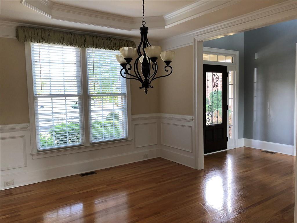 2575 Goodrick Lane Cumming, GA 30041 - Photo 6 of 30 a view of empty room with wooden floor and fan