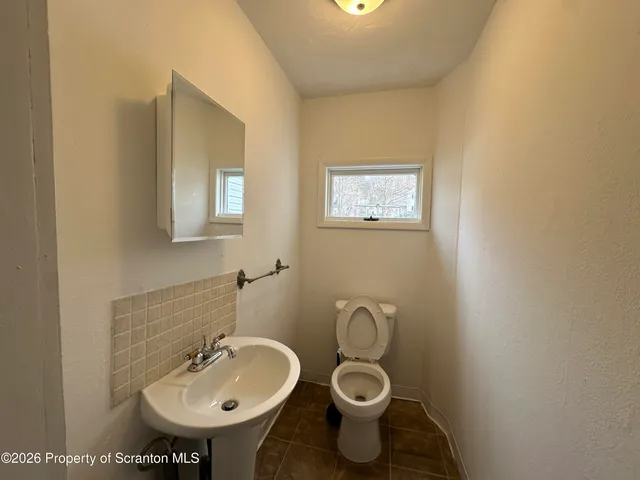 a bathroom with a sink and a toilet