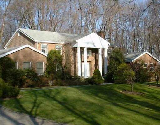 199 Webbs Hill Road Stamford, CT 06903 - Photo 1 of 1 a front view of a house with a yard