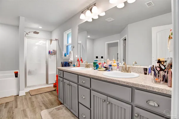 a bathroom with a bathtub and a shower