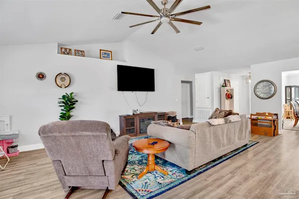 a living room with furniture and a flat screen tv