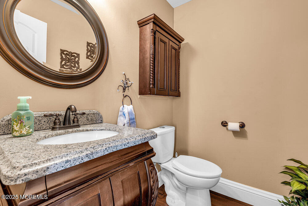 103 Starlight Road Howell, NJ 07731 - Photo 18 of 37 a bathroom with a toilet and a sink