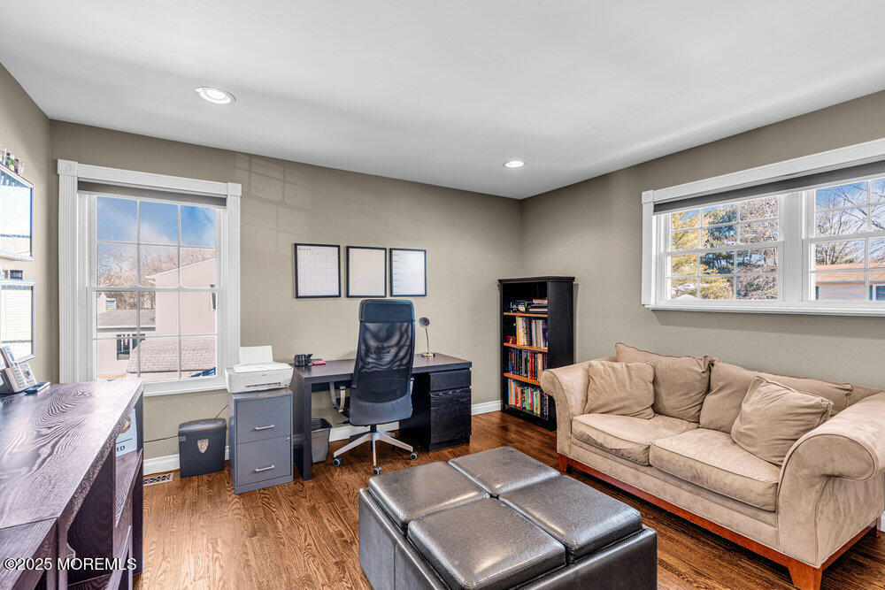 103 Starlight Road Howell, NJ 07731 - Photo 24 of 37 a living room with furniture and a wooden floor