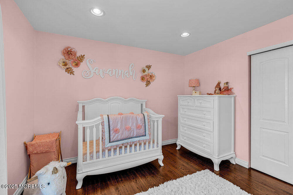 103 Starlight Road Howell, NJ 07731 - Photo 28 of 37 a bedroom with furniture and a wooden floor