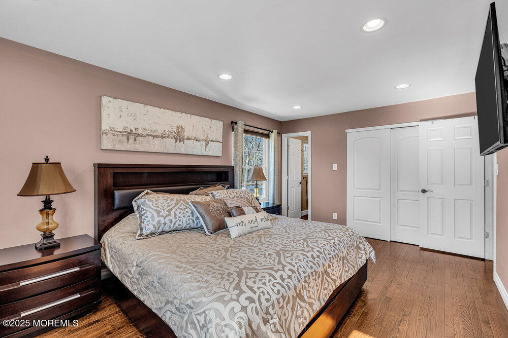 103 Starlight Road Howell, NJ 07731 - Photo 30 of 37 a bedroom with a bed and a lamp on dresser