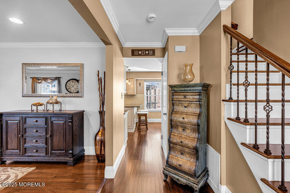 103 Starlight Road Howell, NJ 07731 - Photo 3 of 37 a view of a hallway with wooden floor windows and livingroom view