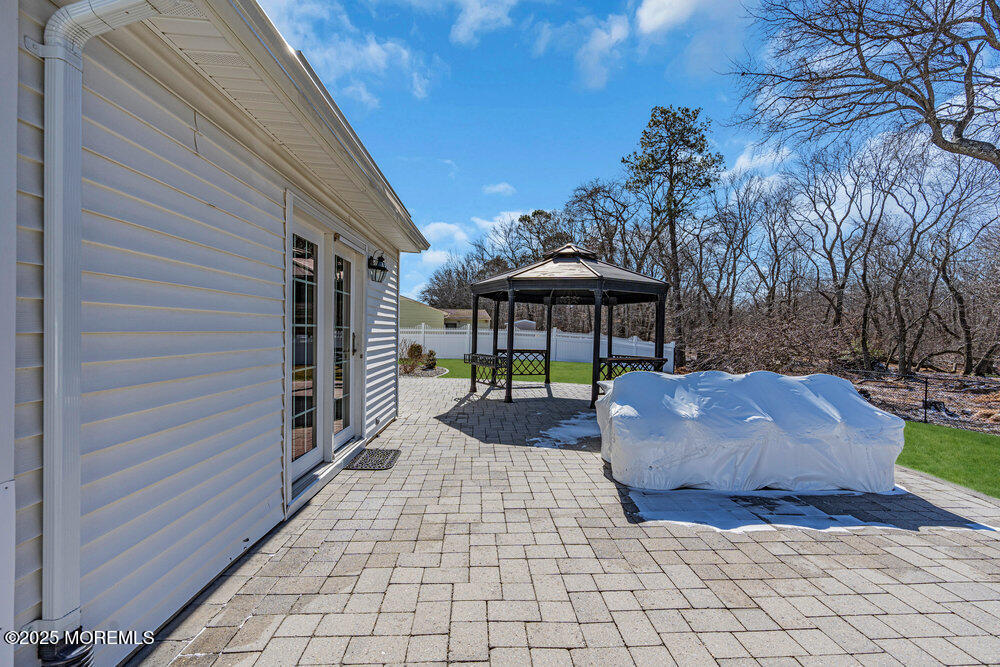 103 Starlight Road Howell, NJ 07731 - Photo 34 of 37 a front view of a house with garden