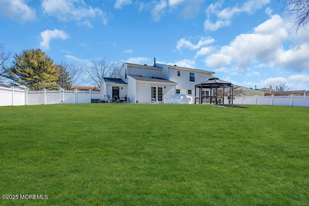 103 Starlight Road Howell, NJ 07731 - Photo 35 of 37 a view of a house with a yard and sitting area