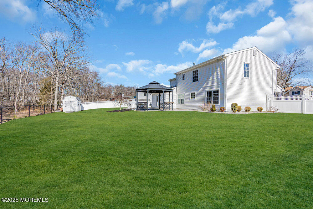 103 Starlight Road Howell, NJ 07731 - Photo 37 of 37 a view of a white house with a big yard