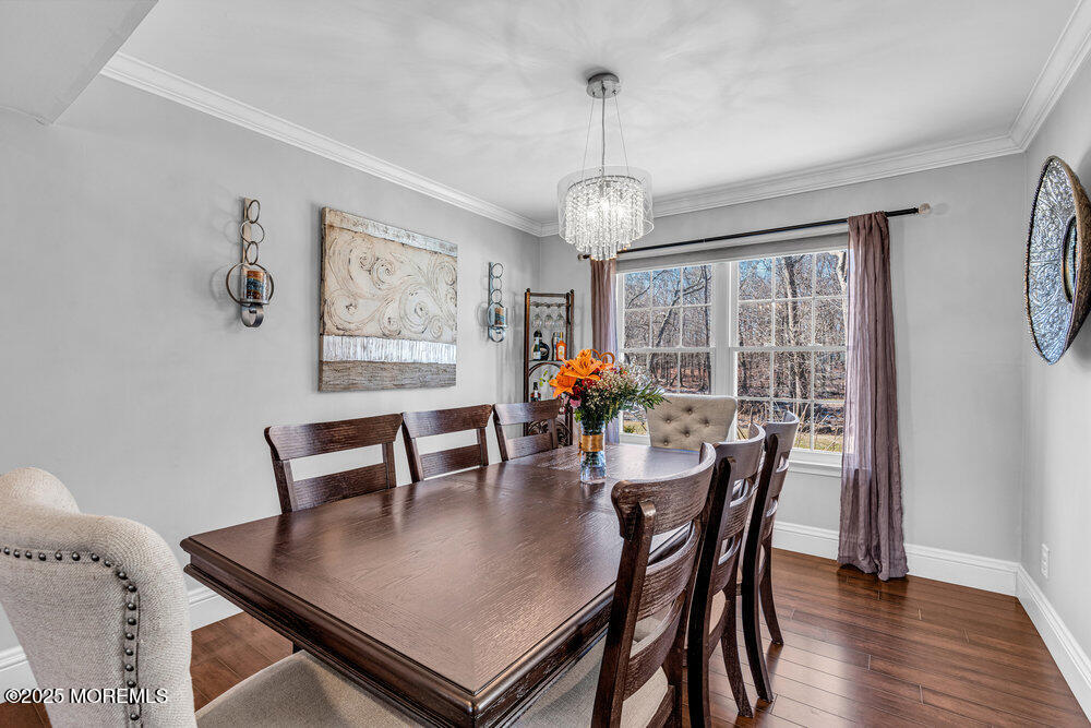 103 Starlight Road Howell, NJ 07731 - Photo 10 of 37 a view of a dining room with furniture window and wooden floor