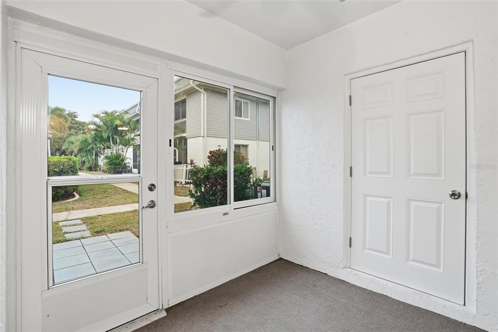 22375 Edgewater Drive, Unit 124 Punta Gorda, FL 33980 - Photo 14 of 29 a view of an empty room with a window