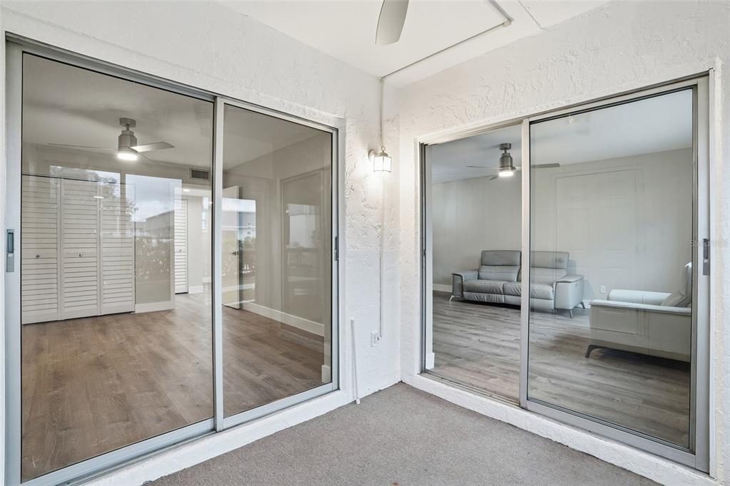 22375 Edgewater Drive, Unit 124 Punta Gorda, FL 33980 - Photo 15 of 29 a bathroom with a glass shower door