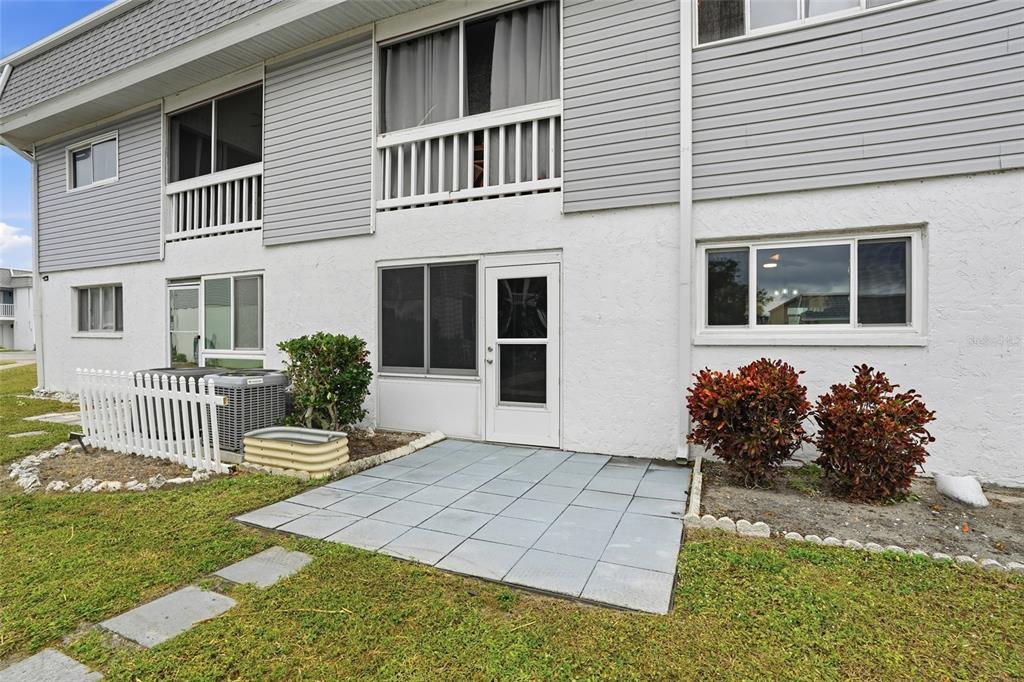 22375 Edgewater Drive, Unit 124 Punta Gorda, FL 33980 - Photo 16 of 29 a front view of a house with garden