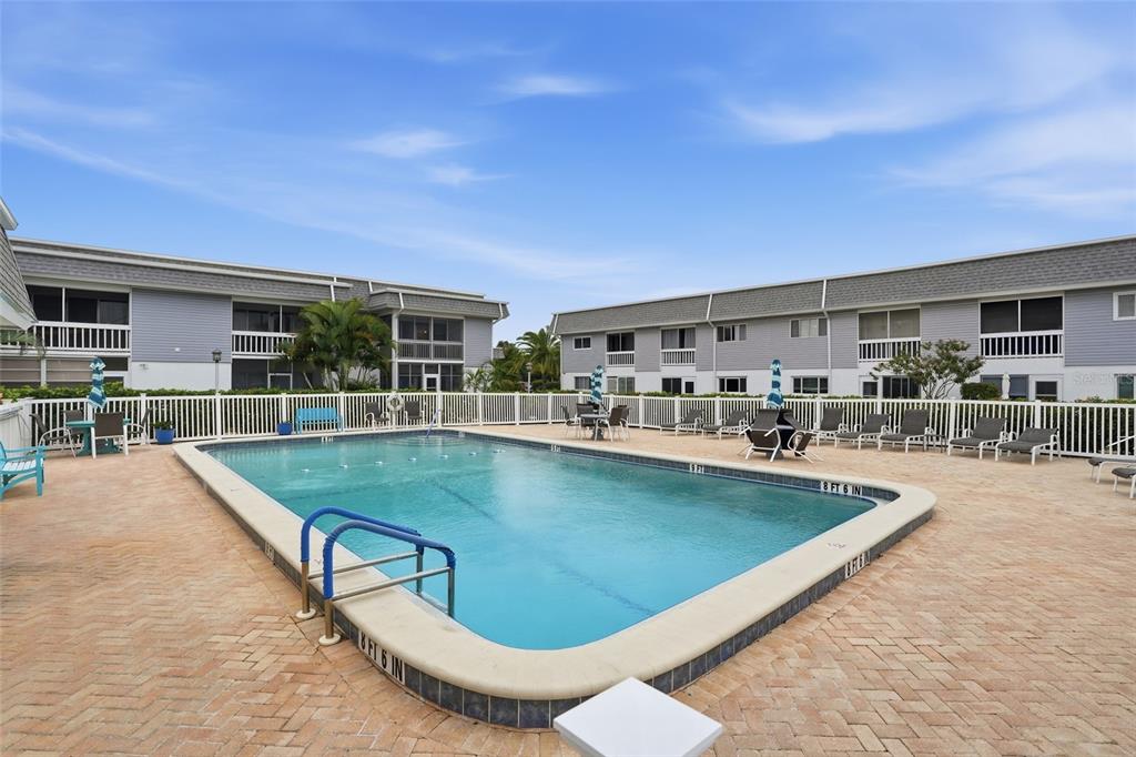 22375 Edgewater Drive, Unit 124 Punta Gorda, FL 33980 - Photo 21 of 29 a view of a swimming pool with outdoor seating