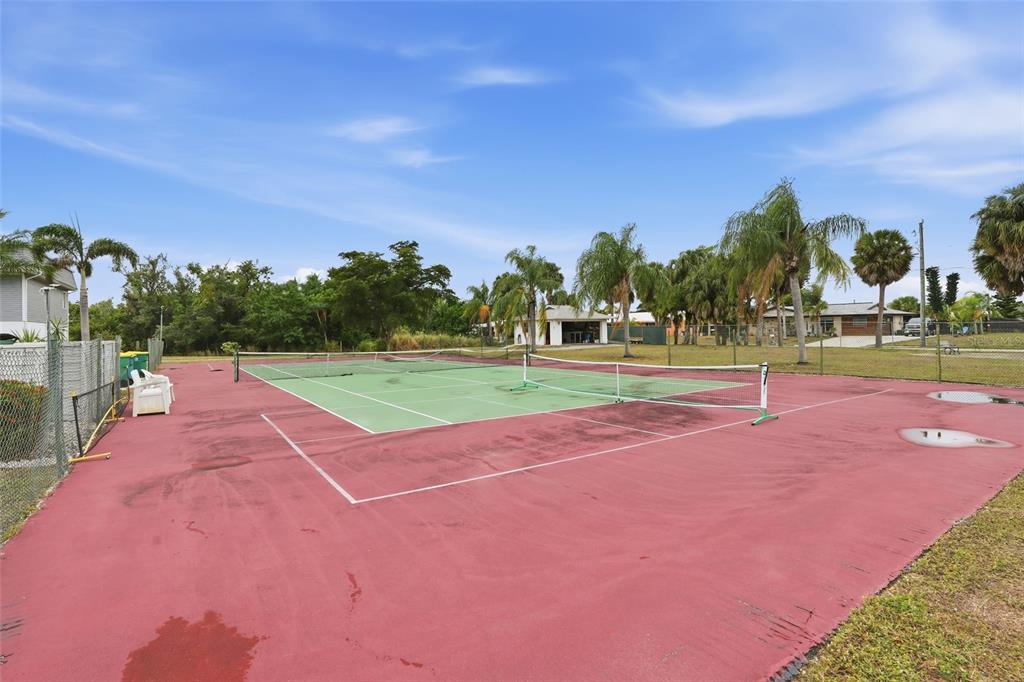 22375 Edgewater Drive, Unit 124 Punta Gorda, FL 33980 - Photo 23 of 29 a view of a tennis court