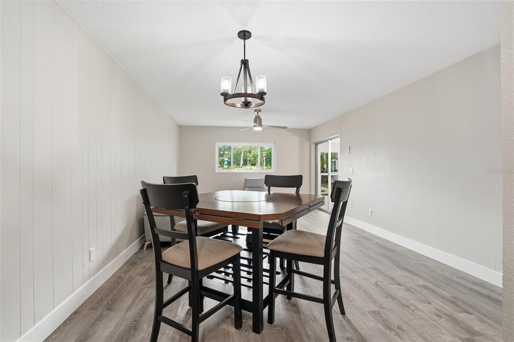 22375 Edgewater Drive, Unit 124 Punta Gorda, FL 33980 - Photo 7 of 29 a view of a dining room with a table and chairs