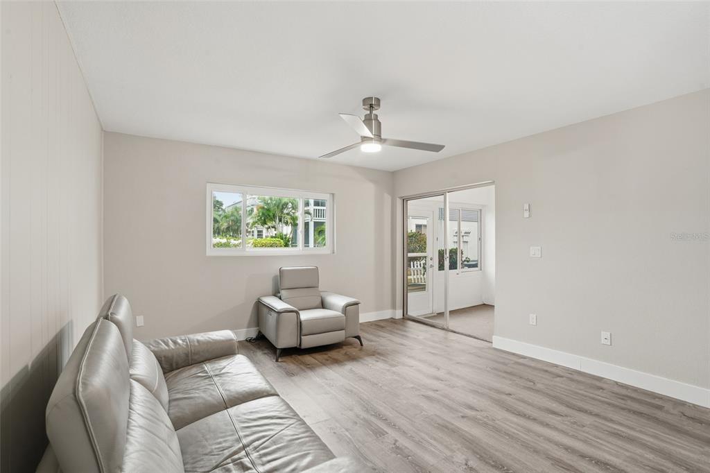 22375 Edgewater Drive, Unit 124 Punta Gorda, FL 33980 - Photo 9 of 29 a living room with furniture and a window