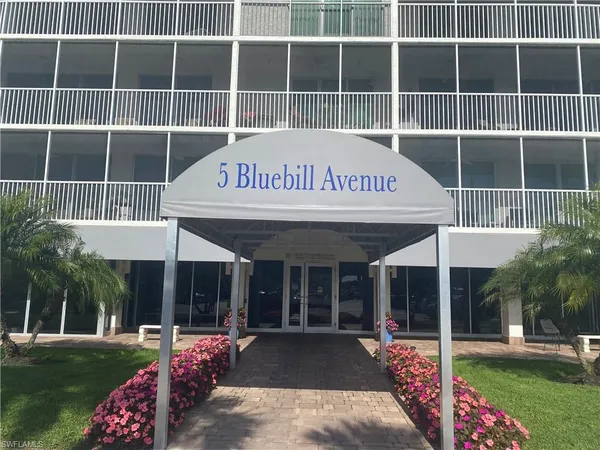 a view of a house with a garden and yard