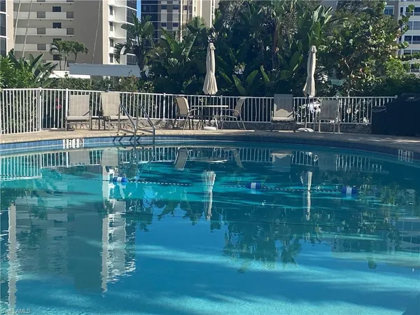 a view of swimming pool from a balcony