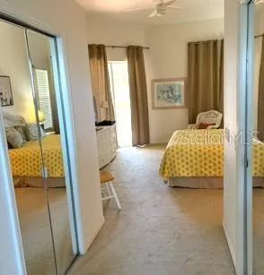 a bedroom with a bed and a walk in closet