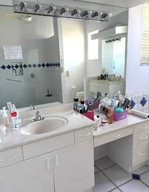 a bathroom with a sink and mirror