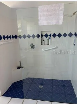 a bath tub sitting next to a window