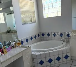 a bedroom with a bed and a cabinets