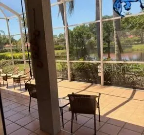 a view of a house with a porch and furniture