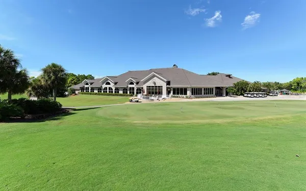 a view of a lake with houses in the back
